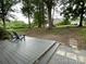Outdoor deck with stone walkway and mature trees at 103 Boyd Dr, Stanley, NC 28164