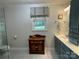 Stylish bathroom with patterned tile floors, vanity, and a glass enclosed shower at 103 Boyd Dr, Stanley, NC 28164
