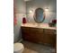 This powder room features a vanity with a decorative mirror and updated fixtures at 103 Boyd Dr, Stanley, NC 28164