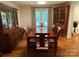 Elegant dining room featuring hardwood floors, a large window, and traditional furnishings at 103 Boyd Dr, Stanley, NC 28164