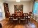 Inviting dining room with hardwood floors, large dining table, and elegant display cabinet at 103 Boyd Dr, Stanley, NC 28164