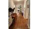 The hardwood hallway features detailed trim and a view into the living area at 103 Boyd Dr, Stanley, NC 28164