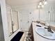 Bright bathroom featuring double sinks, glass shower, and neutral finishes creating a clean and functional space at 1031 Daniel Dr, Stanley, NC 28164