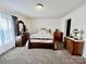 Bedroom featuring carpet, wood furniture and natural light at 1031 Daniel Dr, Stanley, NC 28164