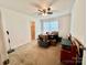 Spacious bedroom with ceiling fan, window, and beige carpet at 1031 Daniel Dr, Stanley, NC 28164