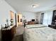 Bright bedroom featuring a comfortable bed, dresser, and natural light at 1031 Daniel Dr, Stanley, NC 28164
