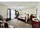 Cozy bedroom with carpet, wood furniture and plenty of natural light at 1031 Daniel Dr, Stanley, NC 28164