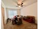 Bedroom with ceiling fan, window, beige carpet, and furniture at 1031 Daniel Dr, Stanley, NC 28164