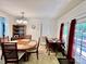 Dining area with two tables, wood furniture, with natural light at 1031 Daniel Dr, Stanley, NC 28164