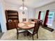 Bright dining area featuring a wood dining set, creating an inviting space for meals at 1031 Daniel Dr, Stanley, NC 28164