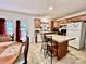 Eat-in kitchen with wood cabinets, an island, and a view of the outdoor patio at 1031 Daniel Dr, Stanley, NC 28164