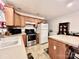 Practical kitchen featuring wood cabinets and modern appliances for easy meal preparation at 1031 Daniel Dr, Stanley, NC 28164