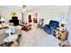 Warm living room showcasing neutral decor, plush carpeting, comfortable furniture and a ceiling fan at 1031 Daniel Dr, Stanley, NC 28164