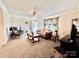 Comfortable living room featuring plush carpeting, neutral paint, comfortable seating and ceiling fan at 1031 Daniel Dr, Stanley, NC 28164