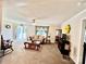 Cozy living room featuring plush carpeting, a ceiling fan, a comfortable sofa and natural light at 1031 Daniel Dr, Stanley, NC 28164