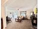 Inviting living room featuring plush carpeting, comfortable seating, and a view of the entryway at 1031 Daniel Dr, Stanley, NC 28164