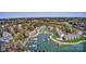 Expansive aerial view of a lakeside community with a marina, condos, and lush trees at 1038 Southwest Dr, Davidson, NC 28036