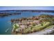 Stunning aerial view of lakeside condos with private boat slips, lush greenery, and serene water views at 1038 Southwest Dr, Davidson, NC 28036