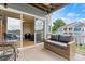 Relaxing balcony with wicker furniture, offering a view of the surrounding community and lake at 1038 Southwest Dr, Davidson, NC 28036