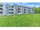 Exterior view of waterfront condos with lush lawn in front at 1038 Southwest Dr, Davidson, NC 28036
