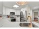 The bright kitchen is equipped with new appliances and white cabinets at 1038 Southwest Dr, Davidson, NC 28036