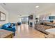 The large living room provides comfortable seating, fireplace and access to the balcony at 1038 Southwest Dr, Davidson, NC 28036