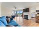 A sunny living room provides a beautiful fireplace, balcony, and views of the lake at 1038 Southwest Dr, Davidson, NC 28036