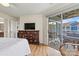 Inviting primary bedroom showcasing a dresser with a TV and patio access at 1038 Southwest Dr, Davidson, NC 28036