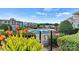 Community pool surrounded by lush greenery, plants, and multiple residential buildings at 1038 Southwest Dr, Davidson, NC 28036