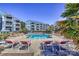 Community pool with plenty of lounge chairs around it in a condo community at 1038 Southwest Dr, Davidson, NC 28036