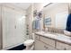 Well-lit bathroom features a white shower, granite countertop, and decorative seashell elements at 1054 Thoroughbred Dr, Iron Station, NC 28080
