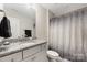 Bathroom featuring granite countertop, modern fixtures and ample storage underneath sink at 1054 Thoroughbred Dr, Iron Station, NC 28080