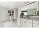A bathroom with double sinks, granite countertops, and custom cabinets at 1054 Thoroughbred Dr, Iron Station, NC 28080