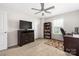 Bedroom featuring dark wood furniture, ample natural light, and designated study space at 1054 Thoroughbred Dr, Iron Station, NC 28080