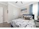 Bedroom features a queen bed, nautical-themed decor, and a ceiling fan at 1054 Thoroughbred Dr, Iron Station, NC 28080