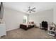 Cozy bedroom with a comfortable bed, a workspace, and great natural light at 1054 Thoroughbred Dr, Iron Station, NC 28080