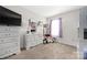 Bedroom with carpeting, white dresser, and decorated with a mirror and plush stuffed animals at 1054 Thoroughbred Dr, Iron Station, NC 28080