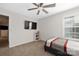 Bright bedroom featuring bed, TV, and modern fixtures that create a relaxing atmosphere at 1054 Thoroughbred Dr, Iron Station, NC 28080