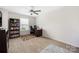 Well-lit bedroom with a desk, bookshelf, and plush rug, perfect for study at 1054 Thoroughbred Dr, Iron Station, NC 28080
