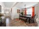 Charming dining room featuring wainscoting and modern lighting at 1054 Thoroughbred Dr, Iron Station, NC 28080
