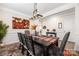 Dining room with decorative lighting, wainscotting and stylish furnishings at 1054 Thoroughbred Dr, Iron Station, NC 28080