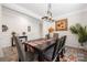 Elegant dining room with wainscoting, modern light fixture, and decor at 1054 Thoroughbred Dr, Iron Station, NC 28080