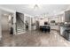 Open concept kitchen with white cabinets, large island, and stainless appliances at 1054 Thoroughbred Dr, Iron Station, NC 28080