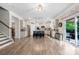 Spacious eat-in kitchen with stainless appliances, island, and door to the outside at 1054 Thoroughbred Dr, Iron Station, NC 28080