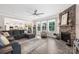 Comfortable living room with stone fireplace, open to kitchen and dining area at 1054 Thoroughbred Dr, Iron Station, NC 28080