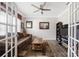 Cozy sitting room with natural light, neutral colors, and double glass doors at 1054 Thoroughbred Dr, Iron Station, NC 28080