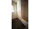 Bathroom with a tub and shower combo, tiled walls, and window for natural light at 1073 Springdale Dr, Maiden, NC 28650