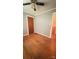 Bedroom featuring hardwood floors, wallpaper, and an open doorway at 1073 Springdale Dr, Maiden, NC 28650