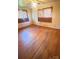Bedroom with hardwood flooring, wallpaper, and natural light at 1073 Springdale Dr, Maiden, NC 28650