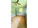 Bedroom featuring striped wallpaper, ceiling fan, and hardwood floors at 1073 Springdale Dr, Maiden, NC 28650
